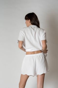 FINAL SALE The Alaia Pajama Set is made with 100% organic combed cotton, these are lightweight, comfy, and sustainable, making them the perfect addition to any sleepwear collection. With a unique scalloped trim for a touch of sophistication. Relaxed silhouette short sleeve Button front One chest pocket Scalloped edges at the sleeve and bottom of shorts Drawstring waist Kristen is 5'9" and wearing a size S/MSizes S/M and L/XL. Short Pj Set, Scalloped Trim, Scalloped Edges, Pj Sets, Combed Cotton, Chest Pocket, Drawstring Waist, Pajama Set, Final Sale