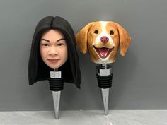 a dog head is on top of two wine bottle stoppers with a woman's face in the middle