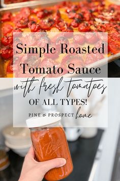 a person holding a jar of tomato sauce in front of an oven with the words, simple roasted tomato sauce