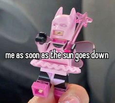 someone is holding up a pink lego batman toy with the caption me as soon as the sun goes down