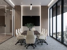 a conference room with white chairs and a large table