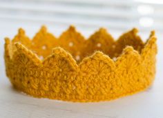 a crocheted crown sitting on top of a table