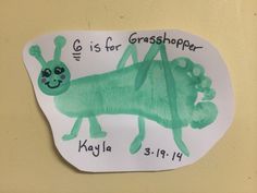 a paper plate with a drawing of a grasshopper on it