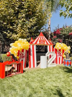 a carnival themed birthday party with balloons and decorations