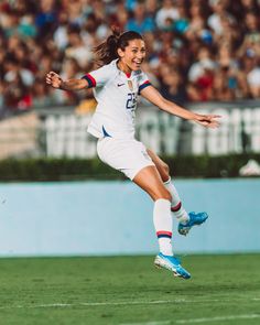 a female soccer player in action on the field