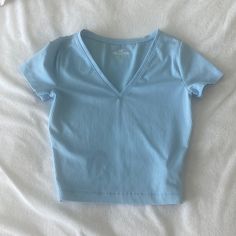 Baby Blue Hollister V-Neck Tee. Never Worn Nwot. Super Stretchy And Soft Material. Cheap Denim Blue Gap Tops, Light Blue V-neck T-shirt For Summer, Blue V-neck T-shirt For Summer, Basic V-neck Top For Summer, Fitted V-neck Basic Tops, Blue Stretch V-neck T-shirt, Casual Blue V-neck Crop Top, Light Blue Stretch Basic Top, Basic V-neck Stretch Crop Top