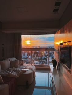 a living room filled with furniture and a flat screen tv