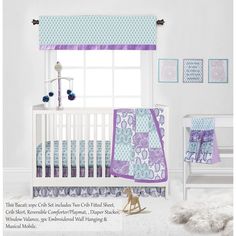 a baby crib bedding set with blue and purple patterns