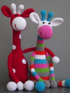 two crocheted giraffes sitting next to each other