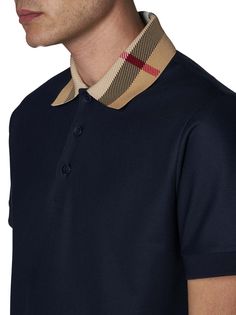 ->cotton, 100% Designer Cotton Tops With Ribbed Collar, Luxury Navy Top For Workwear, Luxury Navy Tops For Work, Luxury Navy Top For Work, Luxury Blue Cotton Tops, Designer Cotton Tops With Collared Neckline, Designer Cotton Top With Collared Neckline, Luxury Cotton Top With Placket, Luxury Navy Polo Shirt