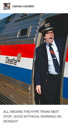 a man in a suit and tie standing next to a train door with his hand on the side