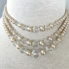 Excited to share the latest addition to my #etsy shop: Art deco pearly crystal necklace #artdeco #midcenturyjewelry #giftsforawife #giftsforsister #giftsformom #giftsforwife #giftsforaunt Vintage Multi-strand Pearl Necklace For Formal Occasions, Elegant Adjustable Faceted Pearl Necklace, Elegant Adjustable Pearl Necklace With Faceted Beads, Silver Faceted Pearl Necklace With Round Beads, Elegant Multi-strand Pearl Necklace With Faceted Beads, Elegant Faceted Pearl Necklace, Elegant Bridal Necklace With Faceted Beads For Formal Occasions, Elegant Beaded Necklaces With Faceted Beads For Anniversary, Elegant Multi-strand Necklaces With Spacer Beads