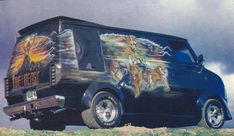 an old van painted with pictures on the side