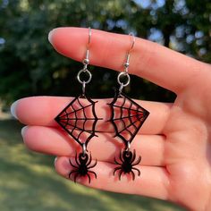 Pair of fun Spider and Spiderweb Dangle Earrings!  * Created from 3mm thick acrylic on a professional grade laser * A bit over 2-1/2 inches long from top of hook to bottom of the spider * Extremely lightweight - each individual earring weighs about an ounce * Super cute and just a little spooky - perfect for Halloween and all year round! **Want a different size? Different color? We can do that! Just contact us and we will work with you to create what you are looking for! Black Hypoallergenic Halloween Earrings, Black Hypoallergenic Earrings For Halloween, Themed Black Dangle Earrings, Spooky Black Drop Earrings, Themed Black Earrings For Party, Themed Black Party Earrings, Knife Earrings, Spider Earrings, Paper Bead Jewelry