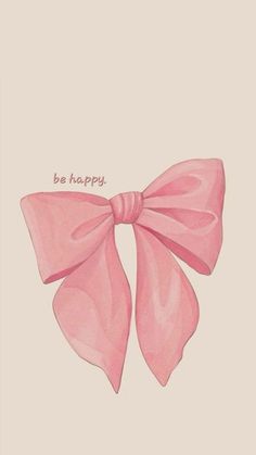 a pink bow with the words be happy written on it's side, against a beige background