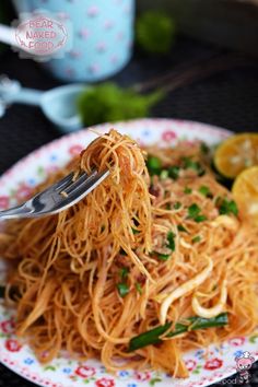 a close up of a plate of food with noodles