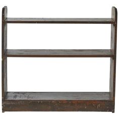 an old wooden shelf with three shelves on it's sides and one is empty