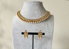 Gold Kundan Pearl Choker Necklace with Earrings  Ethnic Wear. Can be worn for engagement and wedding parties. Indulge in it or gift it and watch the compliments flow! It is advisable to store jewelry in a zip lock pouch (air tight pouch), keep away from water perfume and other chemicals and clean it with dry and soft cloth. FREE SHIPPING!! Bollywood Heavy Jewelry Sets For Diwali, Heavy Bollywood Jewelry Sets For Diwali, Festive Bollywood Kundan Necklace, Bollywood Jewelry Set For Eid With Cutdana, Bollywood Festive Jewelry With Gota Work, Bollywood Style Festive Jewelry With Gota Work, Festive Bollywood Jewelry With Gota Work, Festive Bollywood Jewelry, Bollywood Kundan Necklace For Diwali