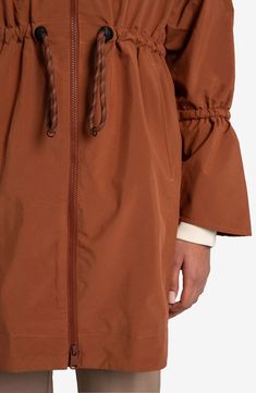 Travel confidently and comfortly in wet weather with this waterproof rain jacket designed for easy packing and breathability. 35" front length; 38" back length (size Medium) Drawcord-toggle hood Drawcord-toggle waist Waterproof Lined 100% polyester Machine wash, tumble dry Imported Oversized Waterproof Windbreaker For Fall, Long Windbreaker Coat For Fall Outdoor, Long Fall Windbreaker For Outdoor, Fall Windbreaker With Drawstring Hood For Rainy Weather, Oversized Waterproof Outerwear For Fall, Oversized Fall Raincoat With Adjustable Hood, Outdoor Fall Parka With Functional Drawstring, Fall Outdoor Parka With Functional Drawstring, Long Sleeve Nylon Raincoat For Rainy Weather