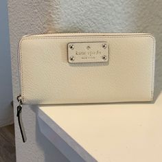 Authentic Kate Spade Large Wallet Still New In Perfect Conditions, White Color Classic White Wallets For Everyday Use, Classic Everyday White Wallets, Classic White Wallets For Daily Use, Everyday White Leather Wallet, White Leather Everyday Wallet, Classic Everyday Cream Wallet, Classic White Wallet For Travel, White Wallets With Interior Card Slots For Everyday, White Wallets With Card Slots For Daily Use