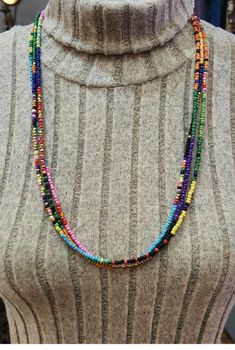 3mm seed beads in mixed and assorted colors with a whimsical colorful fun pattern. 3 strands with each group, the selection you choose will be the selection you'll get.  All are 28 and 28 1/2" long with a snap closure. Snap closures are easy on/off and arthritis friendly.   MORE JEWELRY: https://www.etsy.com/shop/LandofBridget?ref=seller-platform-mcnav§ion_id=46941325 If you have any questions please feel free to contact me! Have a wonderful day! https://landofbridget.etsy.com Long Beaded Necklaces Rainbow, Bohemian Multi-strand Waist Beads With Spacer Beads, Adjustable Multicolor Beaded Chain Waist Beads, Multicolor Beaded Chain Waist Beads For Festivals, Bohemian Multicolor Heishi Beads, Bohemian Multi-strand Waist Beads With Tiny Beads, Handmade Bohemian Multi-strand Waist Beads, Bohemian Handmade Multi-strand Waist Beads, Bohemian Multi-strand Beaded Waist Beads