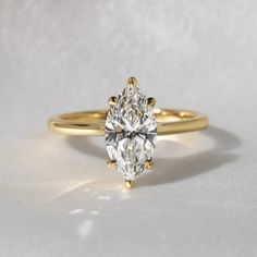 1.50 Ct Marquise Cut Moissanite Engagement Ring, Wedding Ring, Marquise Cut Ring, Elongated Marquise, Hidden Halo Ring  ✥ 𝐌𝐚𝐢𝐧 𝐒𝐭𝐨𝐧𝐞 𝐃𝐞𝐭𝐚𝐢𝐥𝐬 ↣ Shape: Marquise Cut ↣ Type: Moissanite ↣ Weight: 1.50 Ct (App.)  ↣ Color: Colorless ↣ Clarity: VVS ↣ Side Stone: Moissanite ↣ Making Process: Handmade - Crafted by our experienced team ✥ 𝐑𝐢𝐧𝐠 𝐃𝐞𝐭𝐚𝐢𝐥𝐬 ↣ Band Width: 1.7 mm (± 0.10) [Customization Possible] ↣ Metal Purity: Solid Gold (10KT, 14KT, 18KT); Silver (925 Sterling), 950 P Luxury Marquise Birthstone Promise Ring, Moissanite Marquise Ring As Gift, Vvs Clarity Marquise Diamond Ring For Wedding, Marquise Solitaire Diamond Ring As Gift, Anniversary Marquise Ring With Vs Clarity, Marquise Rings With Vs Clarity For Anniversary, Marquise Cut Diamond White Diamond Ring For Marriage, Diamond White Marquise Cut Diamond Marriage Ring, Marquise Cut Diamond White Marriage Ring