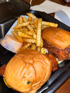 a chicken sandwich and french fries on a tray