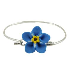 "From the Stranded Treasures Forget Me Not Jewelry Collection. Handcrafted blue Forget Me Not flower bracelet approximately 18mm on a hand wired thick 925 sterling silver bangle bracelet. This bracelet hooks at the flower so it does not slip through you hand.  See Measuring Guide information below. -Original hand sculpted polymer clay flowers -Durable, water-resistant -No molds, no paint, no glue -Flower Size : 18mm -Bangle : 925 sterling silver with hook View matching collection at:  https://www.etsy.com/shop/strandedtreasures/search?search_query=anemone MEASURING GUIDE  Using a flexible measuring tape, measure below the wrist bone. For a snug fit, add 1/4\" to 1/2\". For a comfort fit, add 3/4\" to 1\". For a loose fit, add 1-1/4\". This item is made-to-order. Listing photos are for exam Light Blue Bangle Jewelry Gift, Light Blue Bangle Jewelry For Gift, Handmade Blue Flower Bracelets, Handmade Blue Flower Jewelry, Nickel-free Blue Bangle Bracelets, Blue Nickel-free Bangle Bracelets, Light Blue Bangle Bracelets As A Gift, Forget Me Not Flower, Resin Bangles