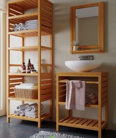 a bathroom with wooden shelving and a white sink