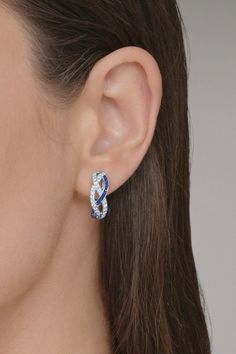 Kwiat sapphire diamond braided hoop earrings in white gold. 18K White Gold 0.50ctw Diamonds (GH, VS1-2), Blue Sapphire 0.75" L Luxury Sapphire Hoop Earrings For Anniversary, White Gold Sapphire Earrings With Pave Setting, White Gold Sapphire Jewelry With Pave Setting, Silver Earrings With Diamond Accents And Lab-created Sapphire, Silver Earrings With Lab-created Sapphire And Diamond Accents, Blue Sterling Silver Earrings With Pave Setting, White Gold Jewelry With Pave Setting And Lab-created Sapphire, Elegant Sapphire Hoop Earrings With Prong Setting, Elegant Sapphire Hoop Earrings