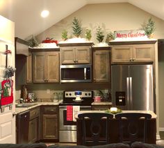 a kitchen decorated for christmas with holiday decorations