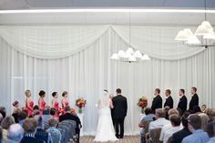 the bride and groom are getting married in front of their guests at this wedding ceremony