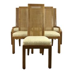 set of four chairs with cane back and seat cushions