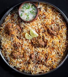 a large bowl filled with rice and meat