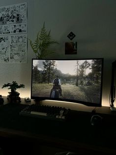 a computer monitor sitting on top of a wooden desk