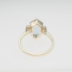 "We designed and handmade this ring in 14k yellow gold. The center natural aquamarine weight is 2.85 carats and measurements are 11 mm x 7 mm. The six side diamonds carat weight is .13 carats. We can make it any size from 5.75 to 6 and you still be able to return it within the listed time frame. Sizing outside of that range makes it a FINAL SALE. We love this ring because it represents the way jewelry should be made with craftsmanship and quality. This ring is anything but ordinary. Our pieces a Fine Jewelry Octagon Ring With Polished Finish, Anniversary Rings With Polished Octagon Shape, Formal Octagon Sapphire Ring In 14k Gold, Formal 14k Gold Octagon Sapphire Ring, 14k Gold Octagon Rings With Polished Finish, Modern Octagon Ring With Accent Stones, Modern Octagon Rings With Accent Stones, Yellow Gold Octagon Topaz Ring For Anniversary, White Gold Octagon Rings In 14k