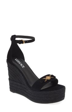 Versace throws it back to the '90s with this ankle-strap sandal branded with Medusa '95 hardware and grounded by a jute-wrapped wedge and platform. 4 1/2" (114mm) heel (size 38.5) 2" platform; 3 1/2" strap height Adjustable ankle strap with buckle closure Leather upper and lining/rubber sole Made in Spain Designer Shoes Black Designer Heels, Versace Gold, Espadrille Wedge, Heels & Wedges, Sandals Brands, Designer Heels, Wedge Sandal, Espadrilles Wedges, Ankle Strap Sandals