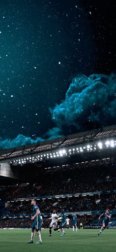 a soccer game is being played in an empty stadium with the sky filled with stars