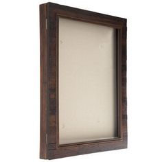 a wooden frame with a white background and brown trimmings on the bottom half