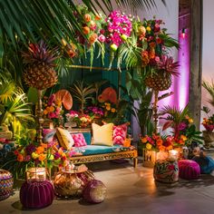 a room filled with lots of colorful flowers and plants