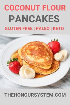 pancakes on a plate with bananas and strawberries in the background text reads coconut flour pancakes gluten free paleo keto