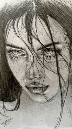 a pencil drawing of a woman's face with long hair and freckles