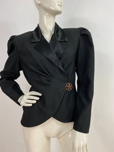 "1980s nu mode blazer, vintage black blazer, shoulder pads, pleated details, peplum blazer,size 9/10 Measurements:  Shoulder (shoulder pads)17\"-18\"/sleeve 23\"/bust (pit-pit)18.5\"/waist 16\"/length 20\"-22\" Mannequin measurements:  5'8\", bust 34\", waist 25\", hip 33\" Please note that vintage clothing sizes can vary greatly.  The Measurements provided  are approximate and are taken lying flat.  I suggest taking a similar garment from your wardrobe and measure it while lying flat.  This way Vintage Blazers For Women, Black Structured Shoulder Blazer For Fall, Black Blazer With Structured Shoulders For Fall, Classic Party Blazer With Structured Shoulders, Black Fitted Blazer With Structured Shoulders, Black Blazer With Structured Shoulders For Office, Elegant Formal Blazer With Padded Shoulders, Elegant Blazer With Padded Shoulders For Formal Occasions, Formal Fitted Blazer With Padded Shoulders