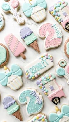 decorated cookies are arranged on a table for a baby's first birthday party or special occasion