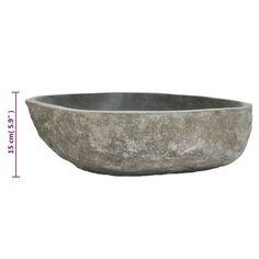 a large stone bowl sitting on top of a white table next to a measuring ruler