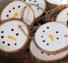 snowman ornaments are made from wood slices