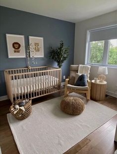 a baby's room with a crib, rocking chair and large rug on the floor