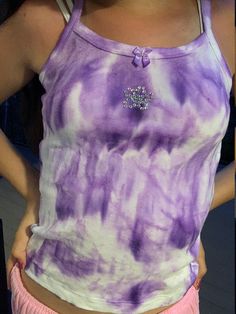 This purple  tie dye tank top with a bedazzled flower and a bow made with love! I am 13 and i always am looking for cheap cute clothing especially tie dye stuff! It's a size 10-12 but super stretchy! I suggest washing it alone the first time just in case but the dye has never leaked in my experience!! ☺️ Tie Dye Y2k, Purple Y2k Tank Top For Spring, Trendy Tie Dye Sleeveless Tank Top, Bedazzled Tank Top, Cute Clothing, How To Tie Dye, Dye Ideas, Tie Dye Outfits, Tie Dye Tank Top