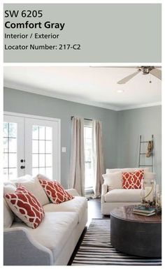 a living room with two couches and a coffee table in front of a door