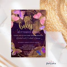 a purple and gold baby shower with butterflies on it